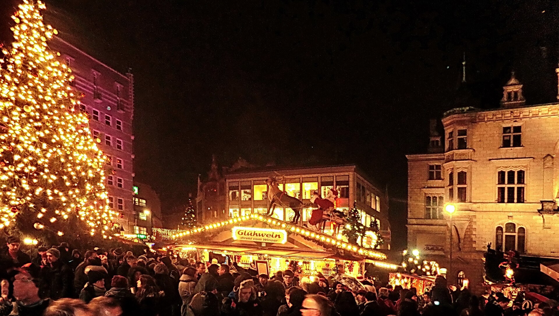 Christmas market lights and Glühwein stalls