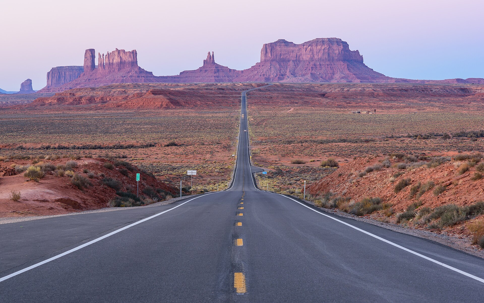 Desert highway road trip toward Monument Valley